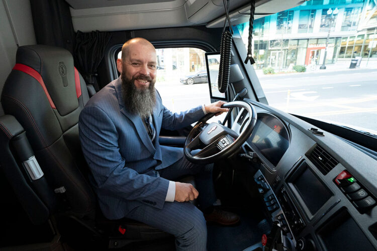 Brandon Meredith sits in his new Kenworth T680 Sign (Photo courtesy of U.S. Chamber of Commerce)