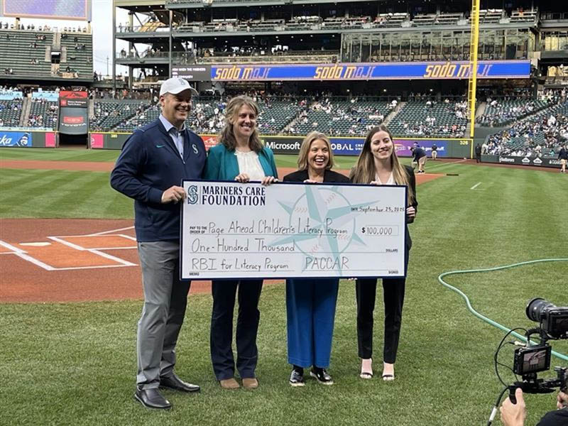 Melanie Presents PACCAR Donation Check